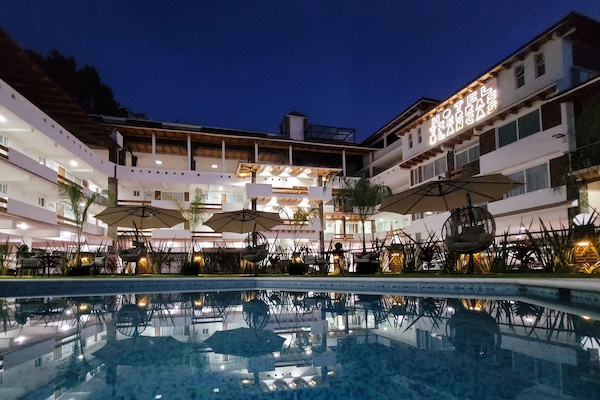 Outdoor pool, pool umbrellas, sun loungers