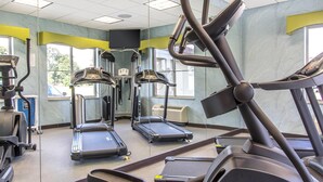 A gym with treadmills, elliptical machines, and a stationary bike. - Suburban Studios Donaldsonville - Gonzales (Donaldsonville)