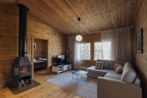 Family Cottage, 2 Bedrooms, Sauna, Beachfront | Living area | 50-inch flat-screen TV with cable channels, TV, fireplace