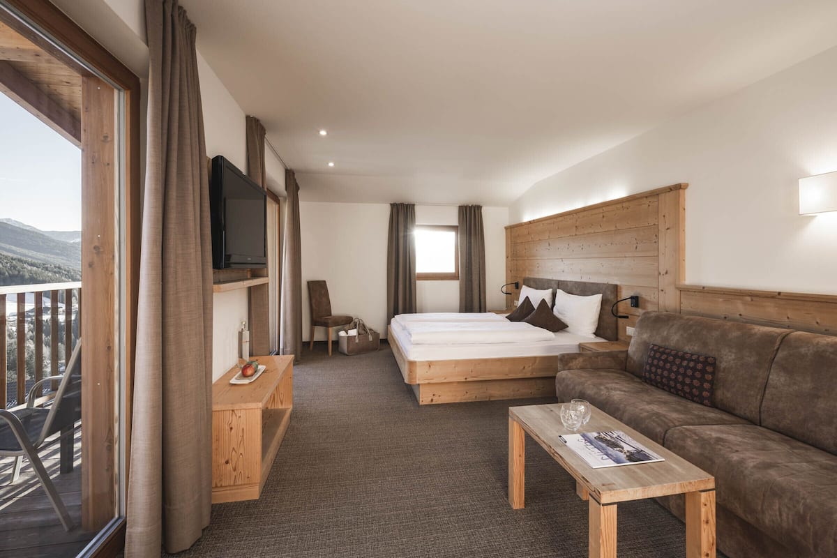 superior double room | in-room safe, desk, laptop workspace, blackout curtains