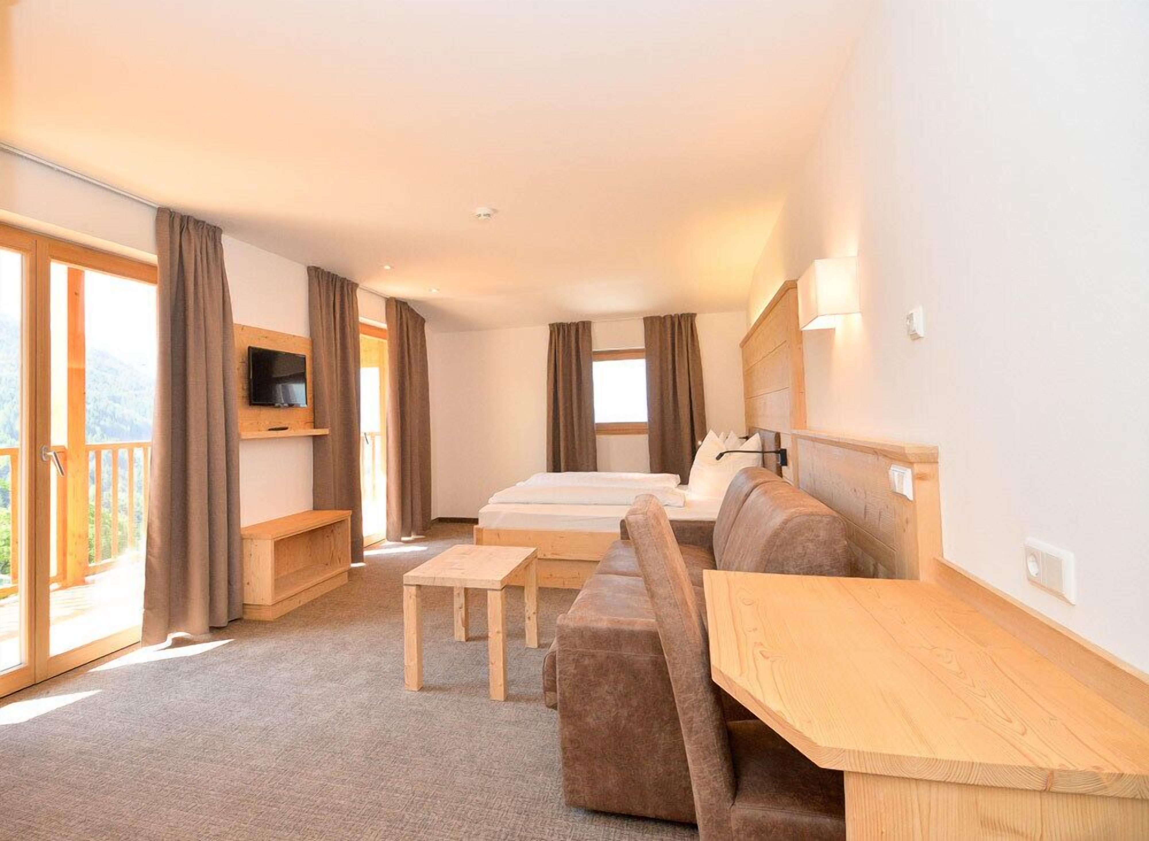 superior double room | in-room safe, desk, laptop workspace, blackout curtains