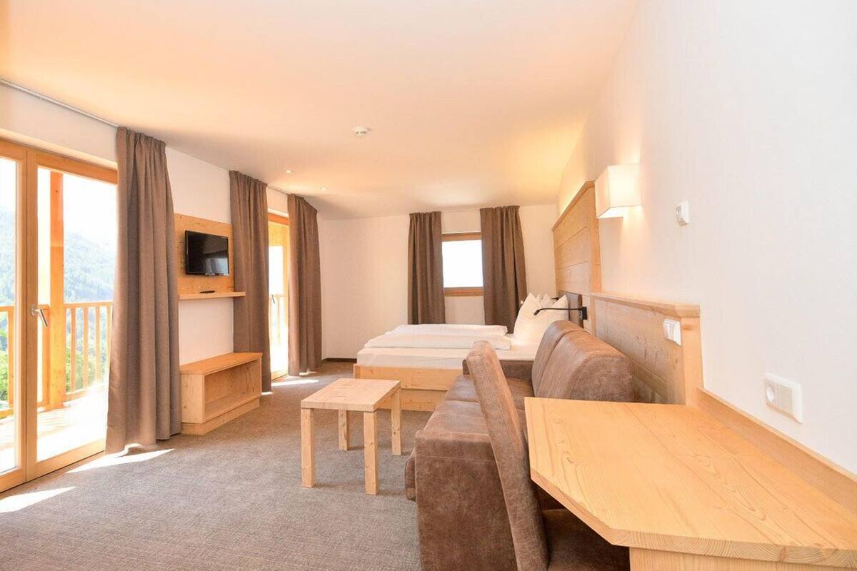 superior double room | in-room safe, desk, laptop workspace, blackout curtains