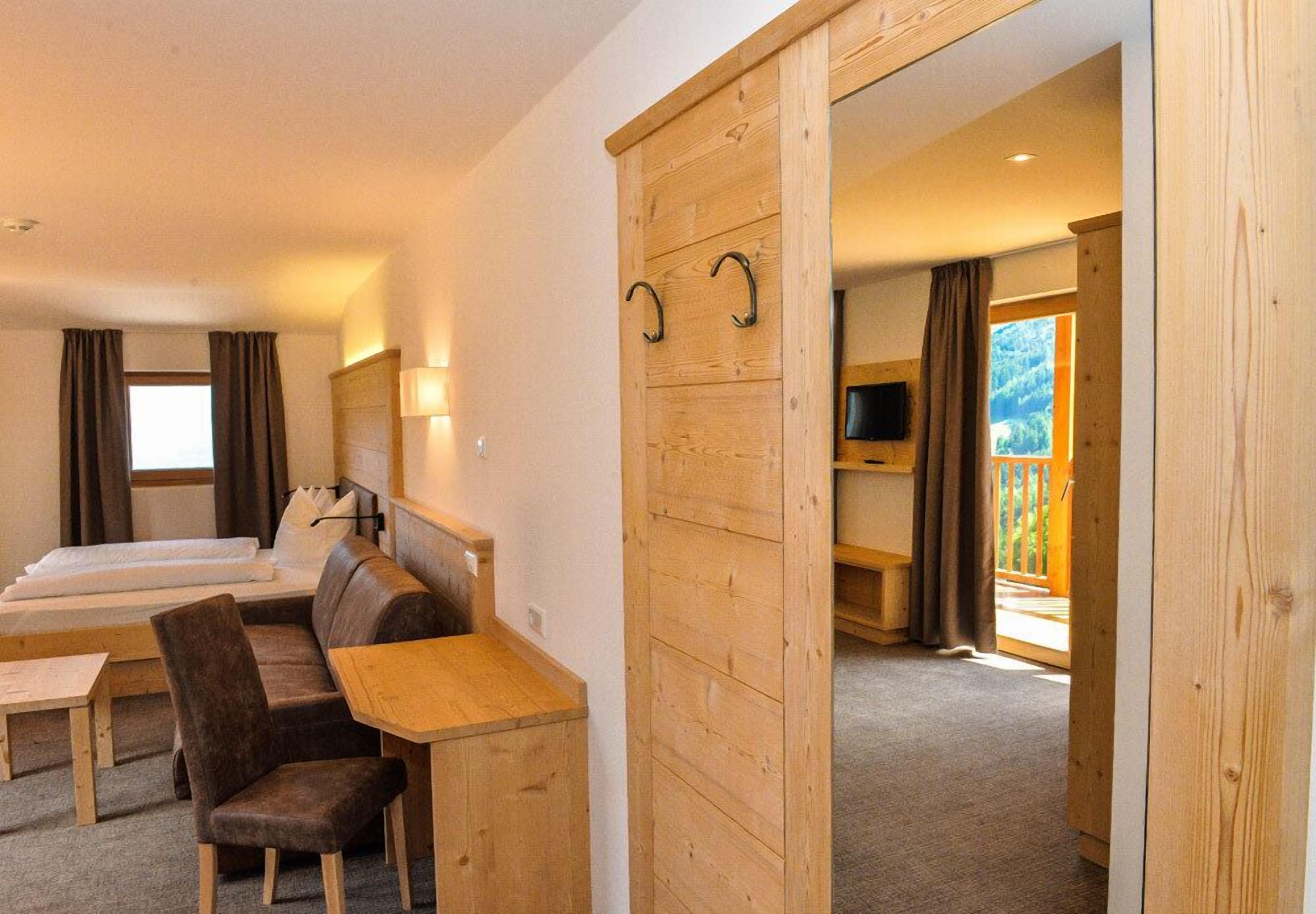 superior double room | in-room safe, desk, laptop workspace, blackout curtains