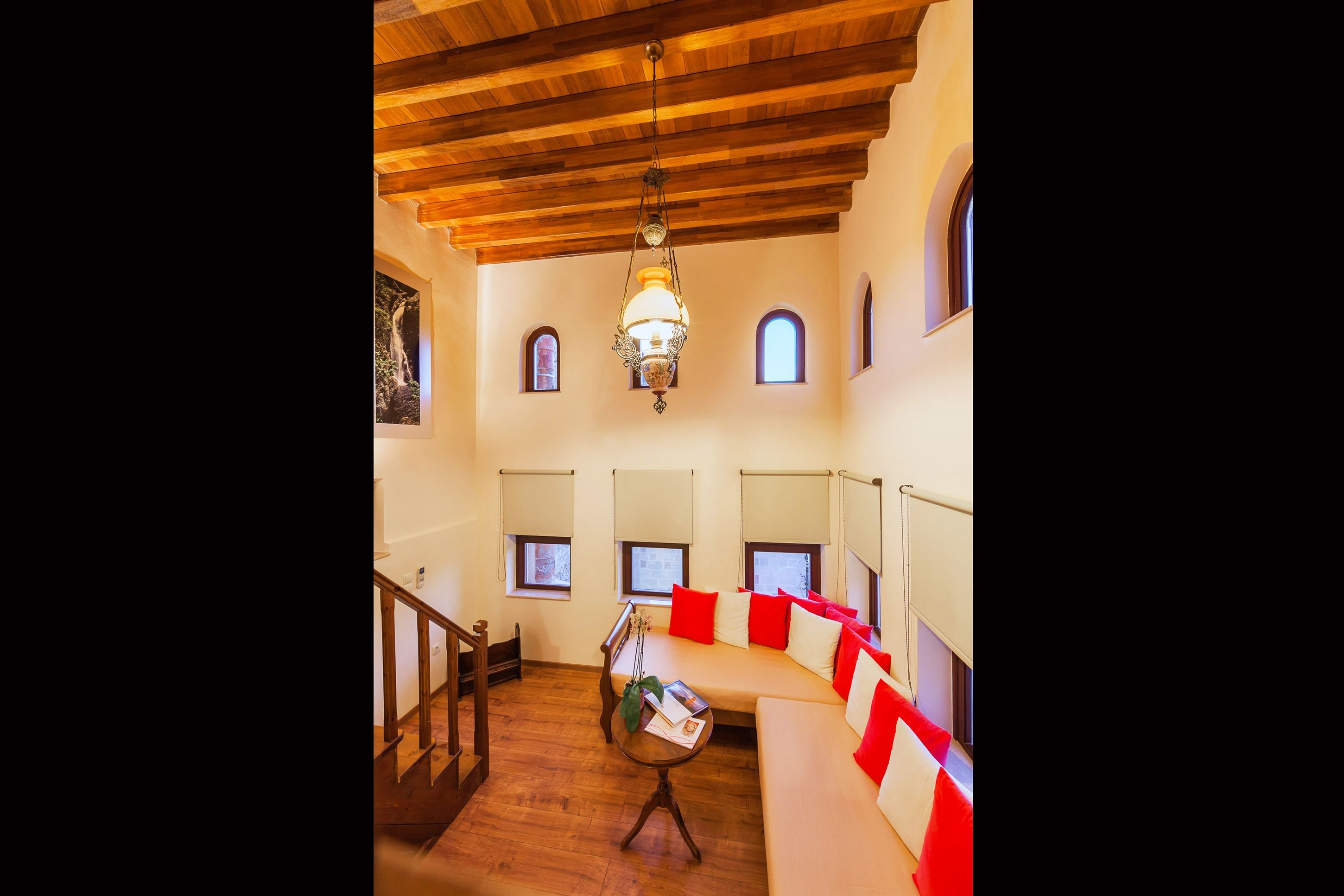 superior suite (nike of samothraki) | living area | 32-inch lcd tv with satellite channels, tv, books