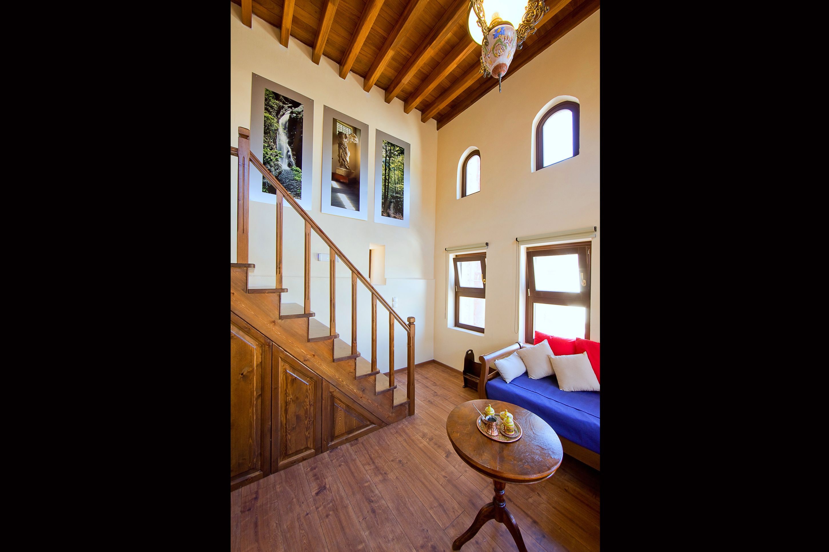 superior suite (nike of samothraki) | living area | 32-inch lcd tv with satellite channels, tv, books