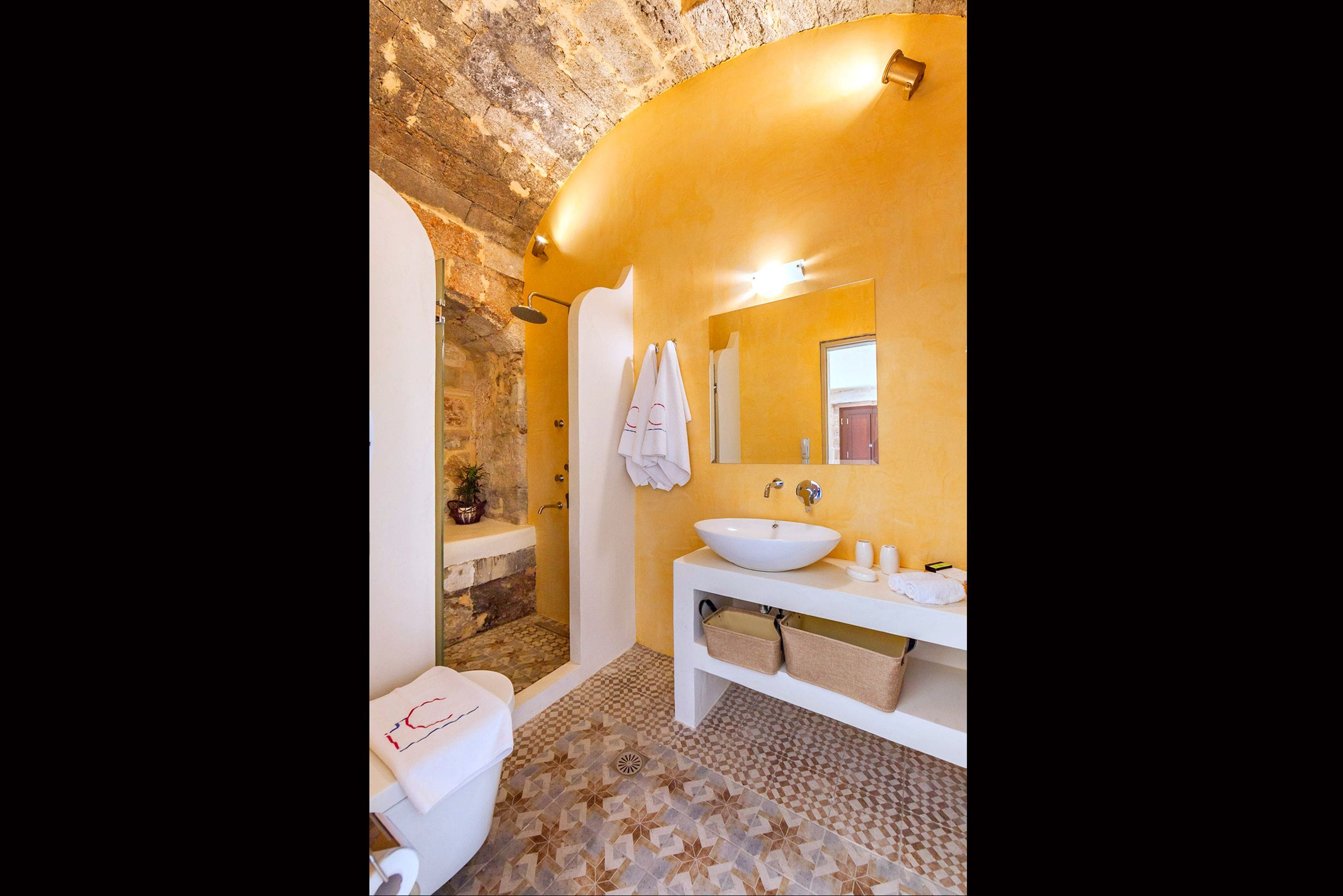 junior suite (temple of apollo) | bathroom | shower, designer toiletries, hair dryer, bathrobes