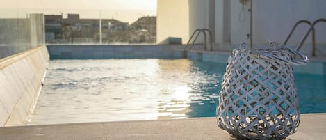 Seasonal outdoor pool, pool umbrellas, sun loungers