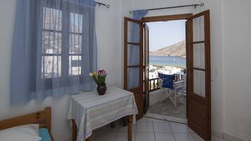 Chambre Triple, vue mer | Bureau, Wi-Fi gratuit