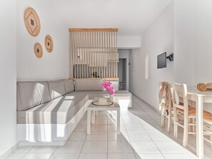 Family Apartment, 1 Bedroom, Non Smoking, Partial Sea View (Αphodite) | Living area | 32-inch Smart TV with digital channels, Netflix, streaming services
