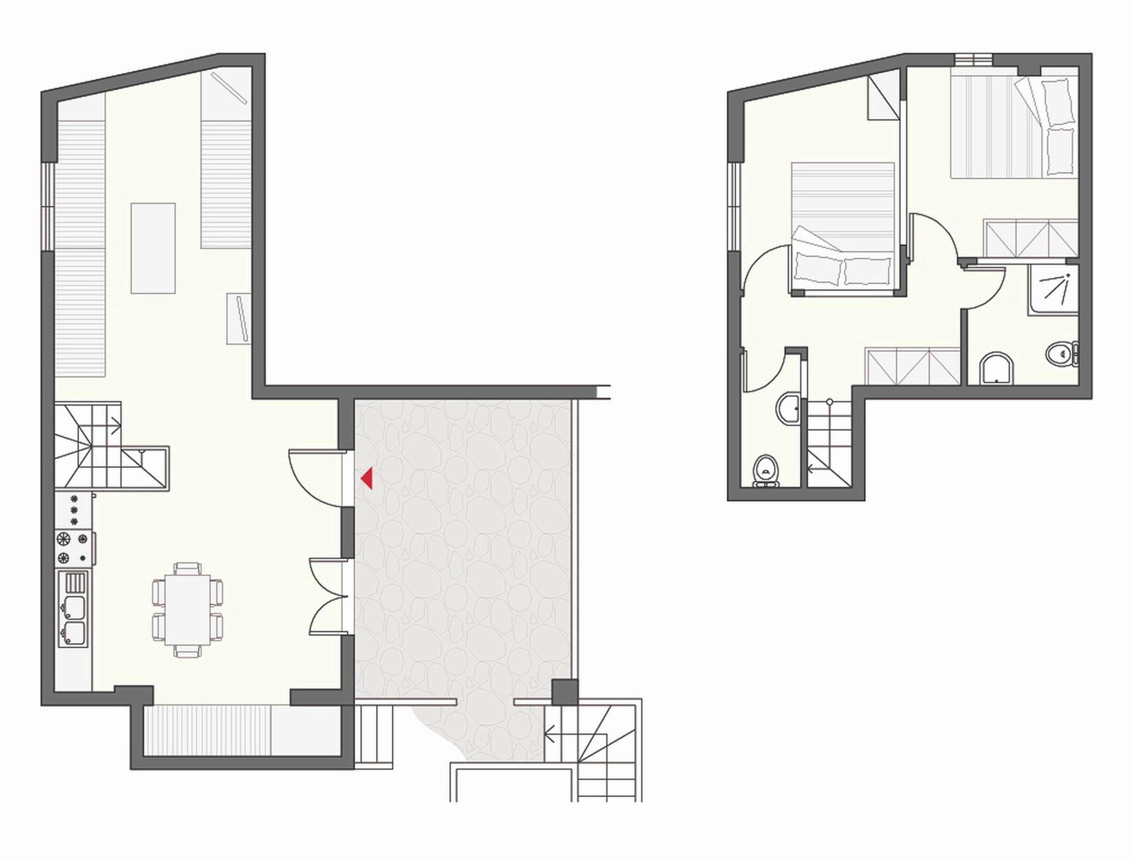 A floor plan of a hotel room with a kitchen area, a dining table, and a bathroom.
