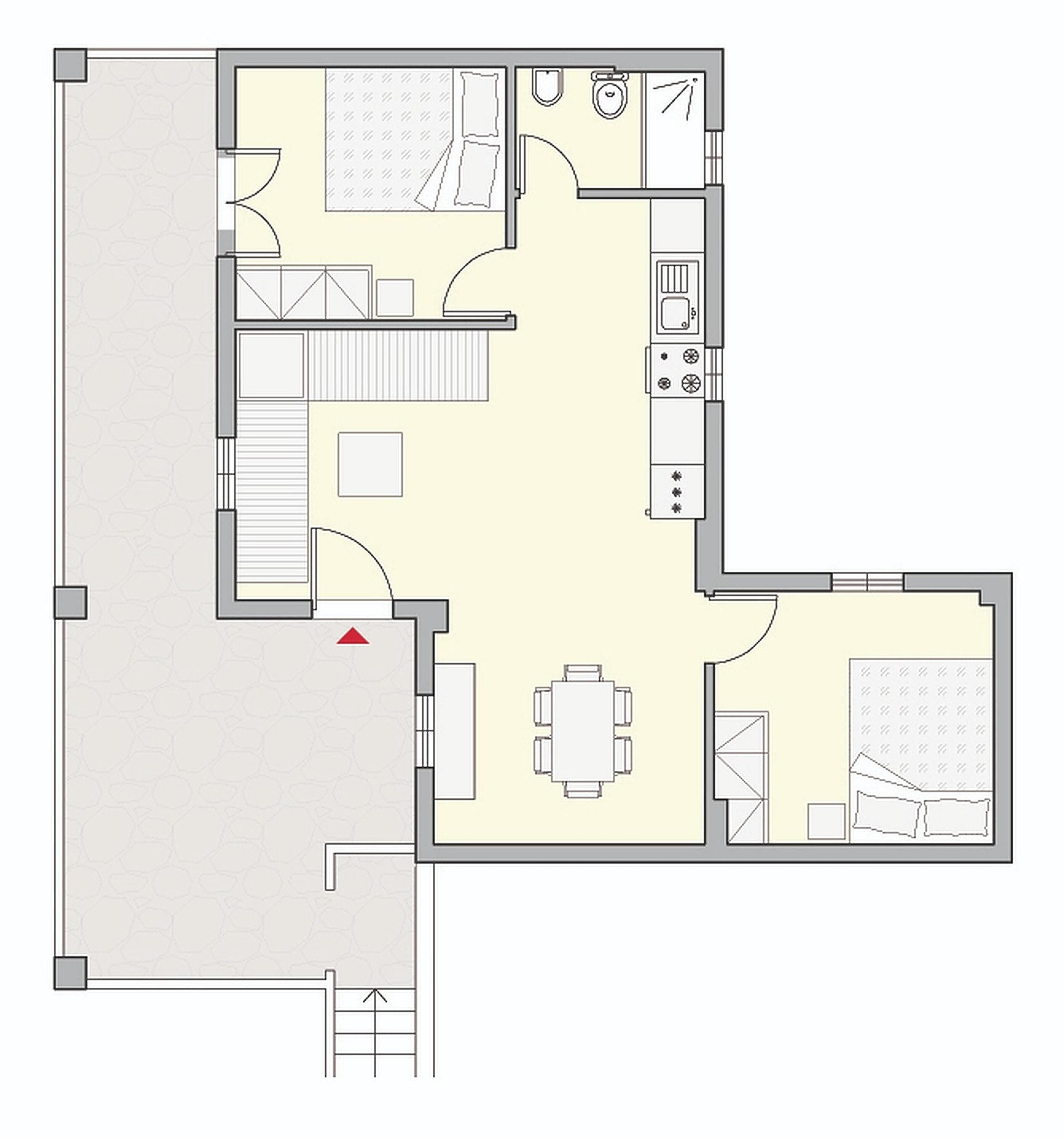 Un plan d’étage d’une chambre d’hôtel comprenant un lit, un bureau, une chaise, une petite salle de bain et une kitchenette.