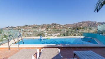 Seasonal outdoor pool, pool umbrellas, pool loungers