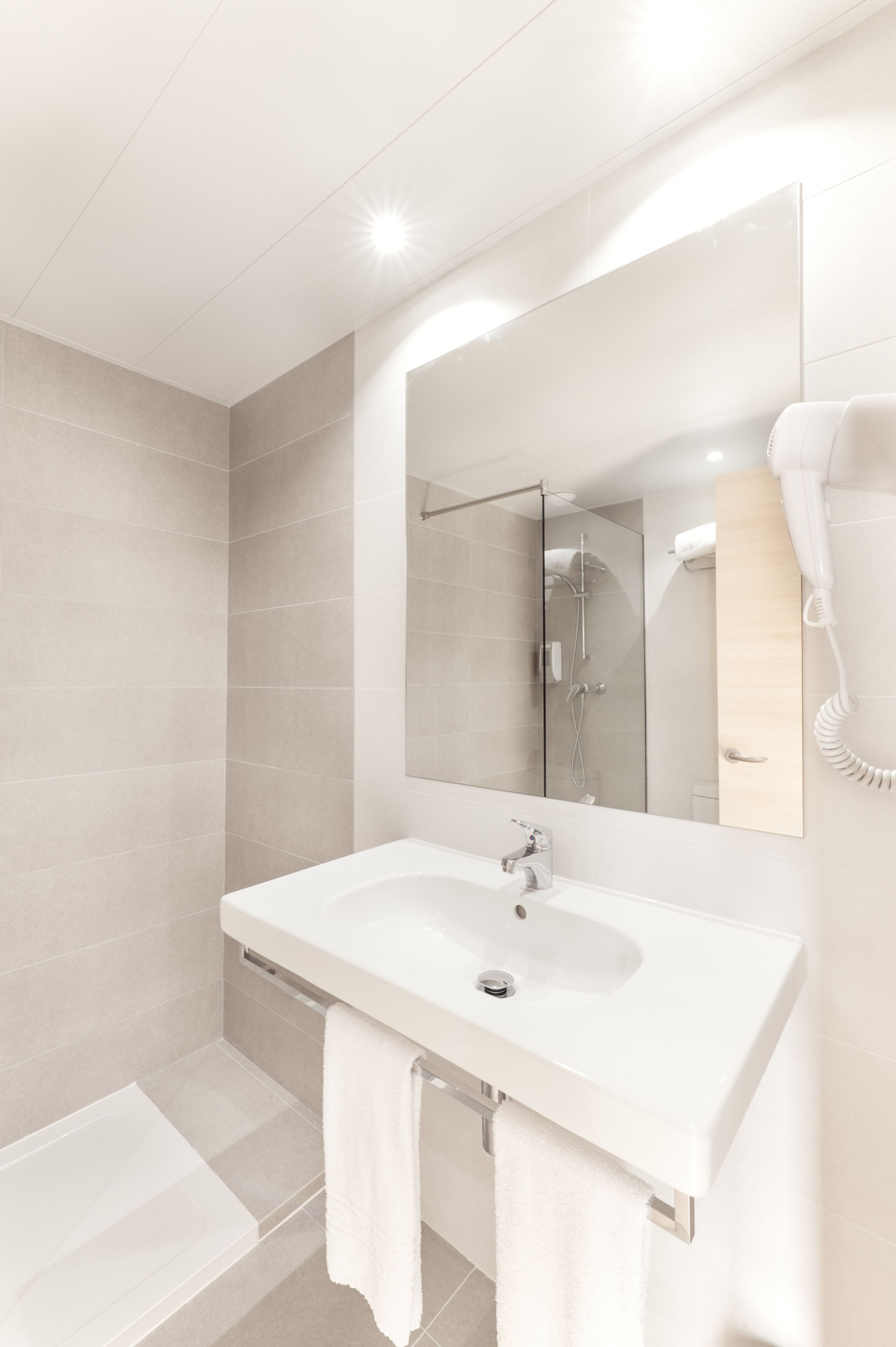 shower, free toiletries, hair dryer, towels