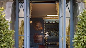 A room with a bed, a dresser, a chair, and a lamp. - Batty Langley's (London)