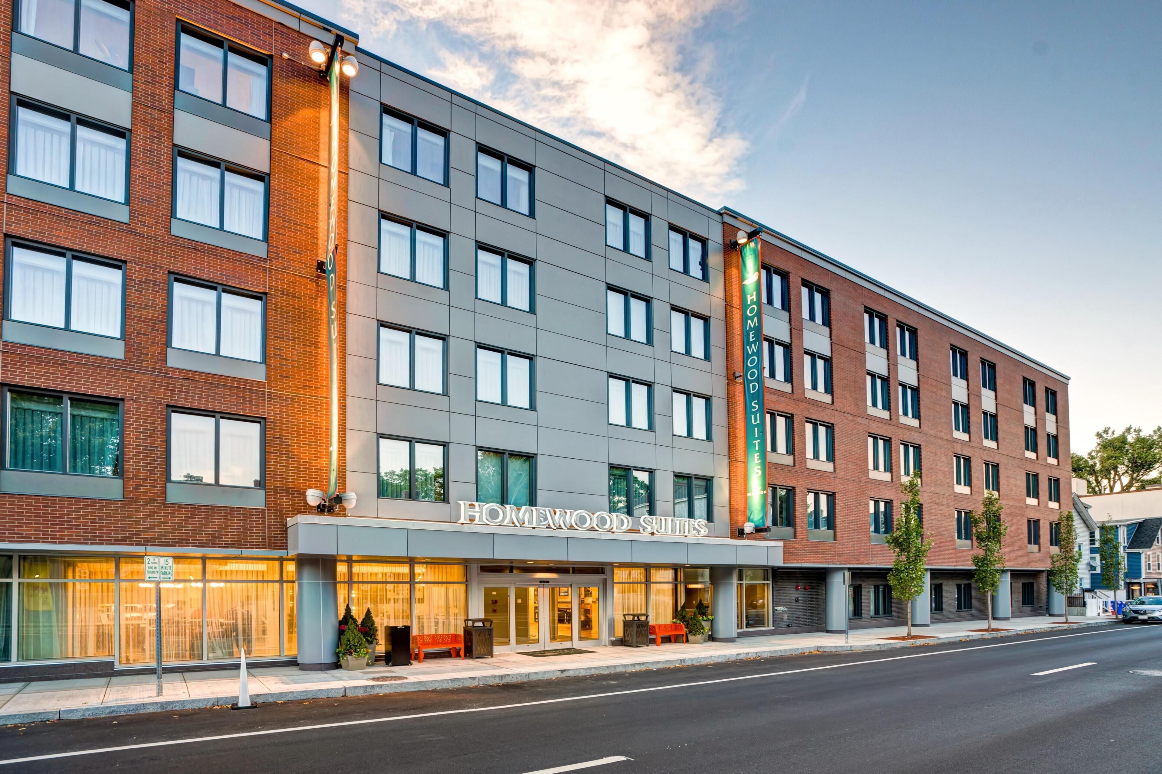 A multi-story hotel with a modern facade, large windows, and a prominent entrance.