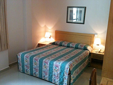 Habitación. New Orchid Hotel