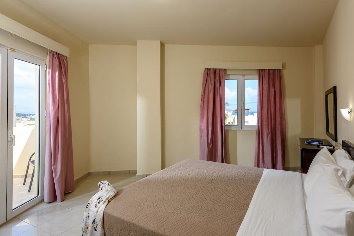 Apartment, 1 Bedroom, Sea View | 1 bedroom, in-room safe, individually decorated, individually furnished