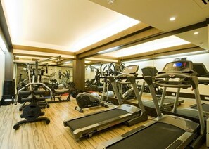 A gym with treadmills, ellipticals, and weight machines. - Howard Plaza The Fern, Agra (Agra)