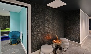A modern interior with a teal wall, a black speckled wall, and a white ceiling vent. - Capetonian Hotel (Cape Town)