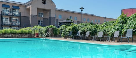 Seasonal outdoor pool, open 10:00 AM to 8:00 PM, pool loungers