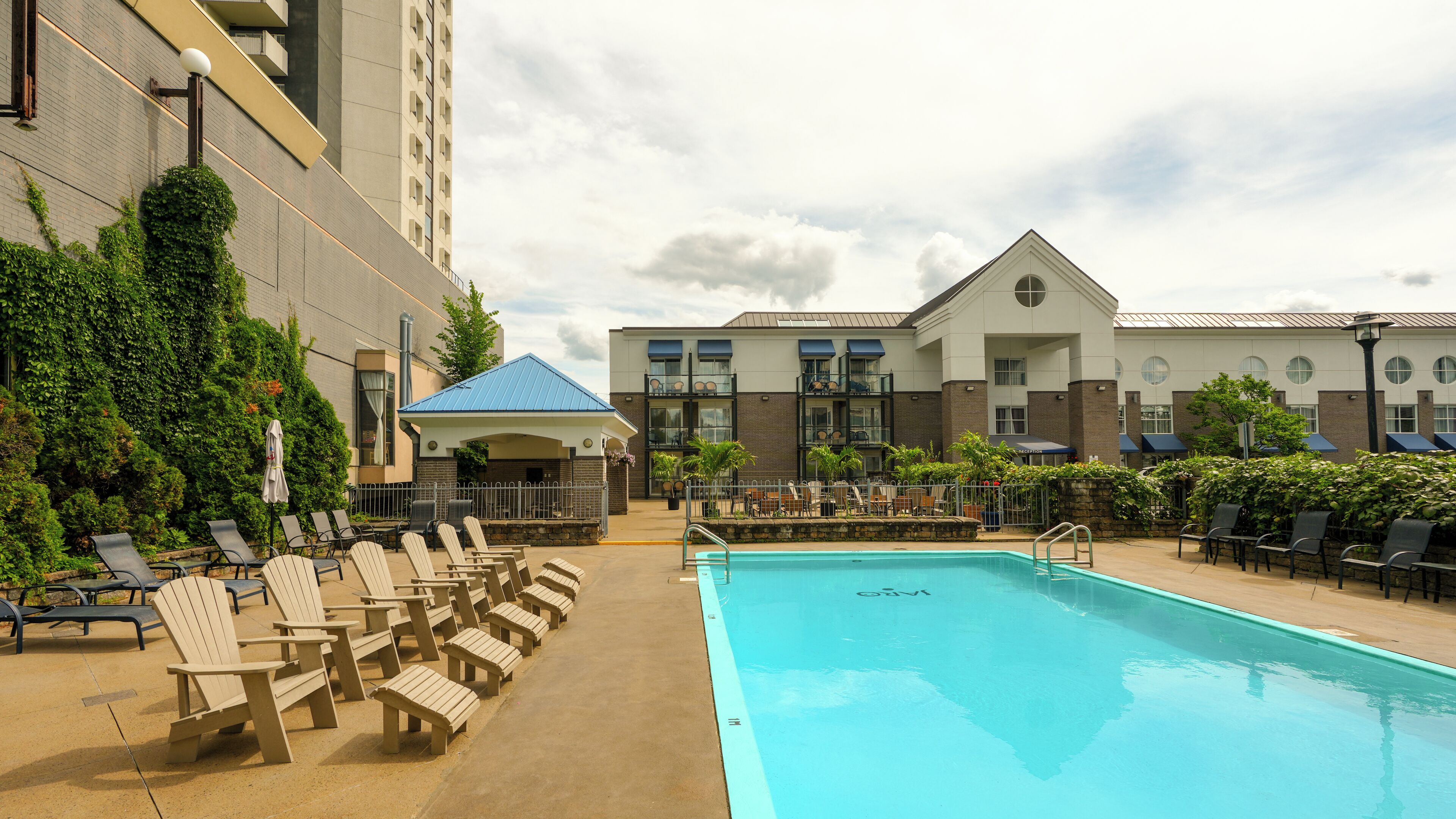 Seasonal outdoor pool, open 10:00 AM to 8:00 PM, pool loungers