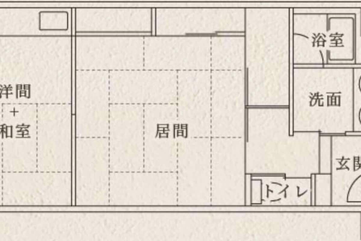 Ein Grundriss mit Wohnbereich, Schlafzimmer, Bad und Küche.