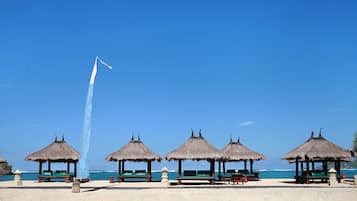 On the beach, white sand, free beach cabanas, sun loungers