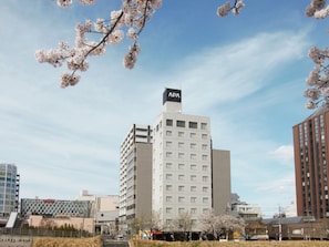 A multi-story building with a sign reading "APA" on top. - APA Hotel Mito-ekimae (Mito)