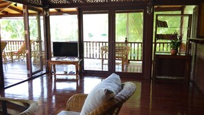 Garden Views 2 Bedrooms Villa | Living area | 32-inch LCD TV with cable channels, TV, DVD player - Green Coconut Village C3 (Koh Samui)