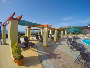 Outdoor pool, pool umbrellas, sun loungers