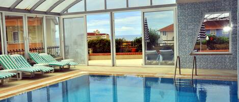 Indoor pool, outdoor pool, pool umbrellas, sun loungers