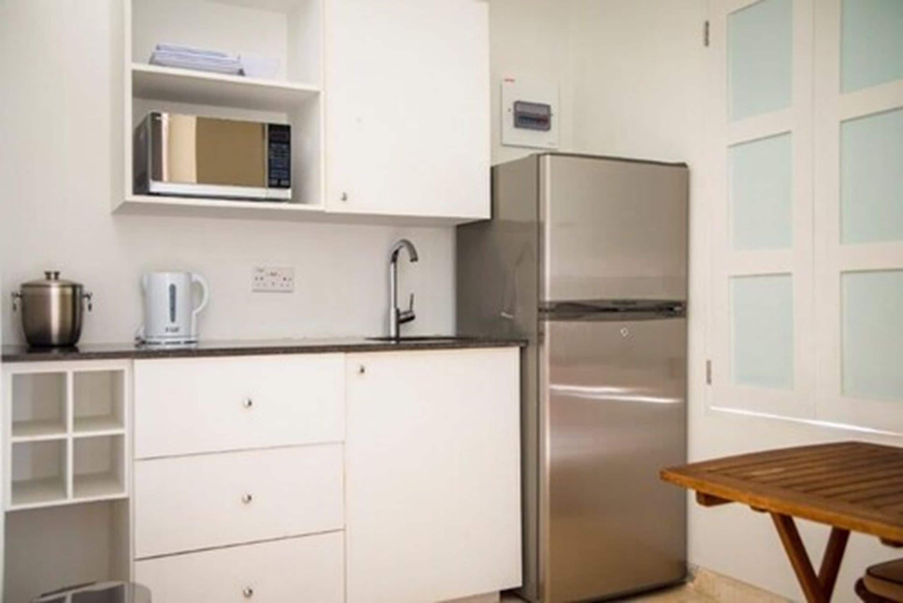 family villa, 2 bedrooms, 2 bathrooms, kitchenette, garden area | private kitchen | fridge, microwave, coffee/tea maker, electric kettle