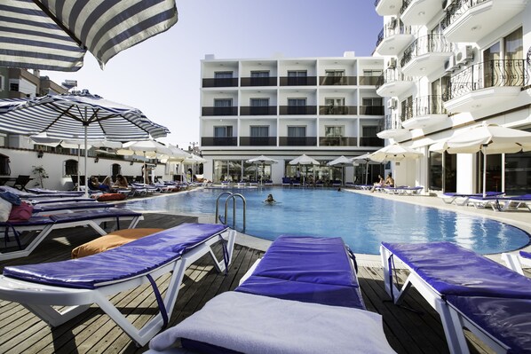 Seasonal outdoor pool, pool umbrellas, pool loungers