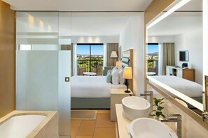 Separate tub and shower, designer toiletries, hair dryer, bathrobes