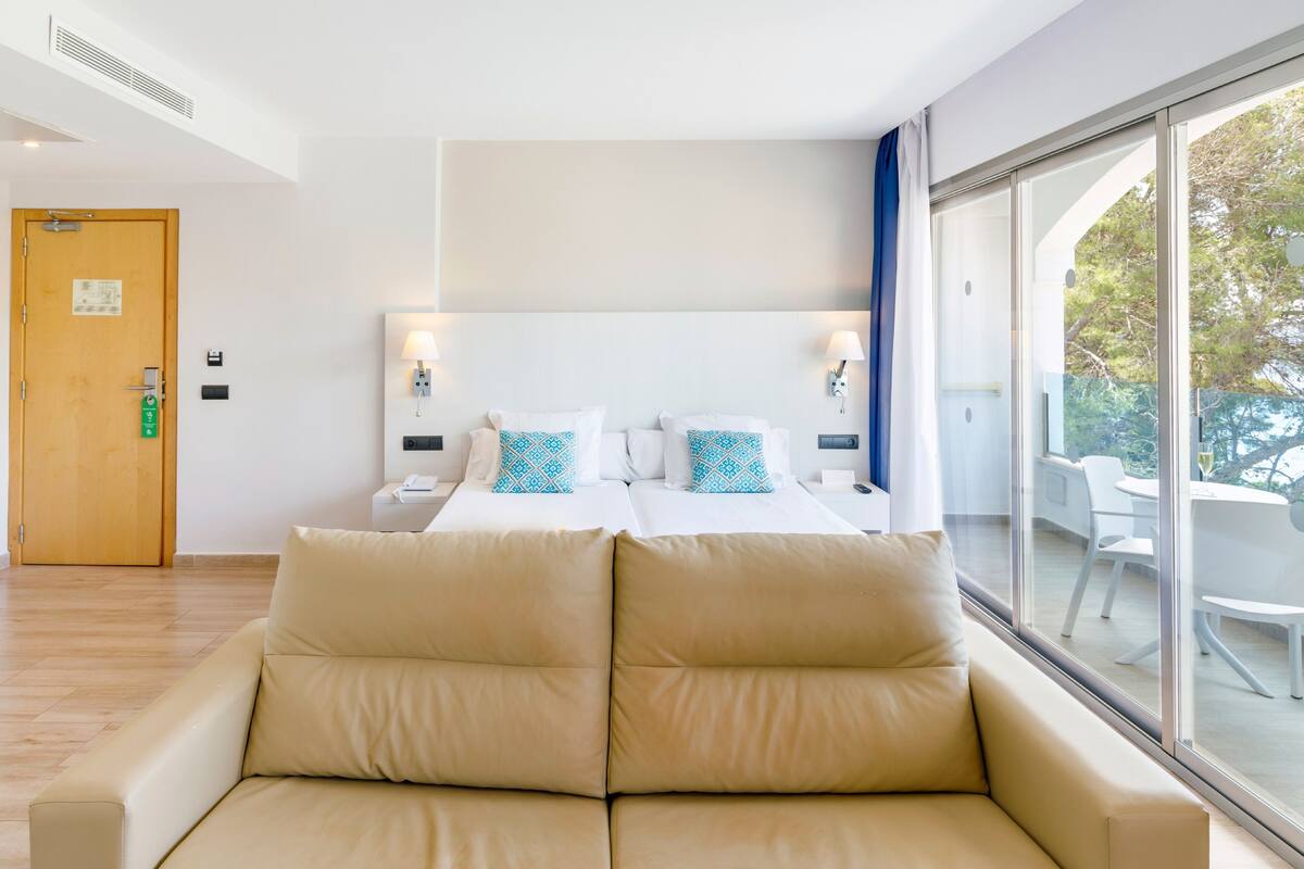 Minibar, desk, blackout curtains, iron/ironing board