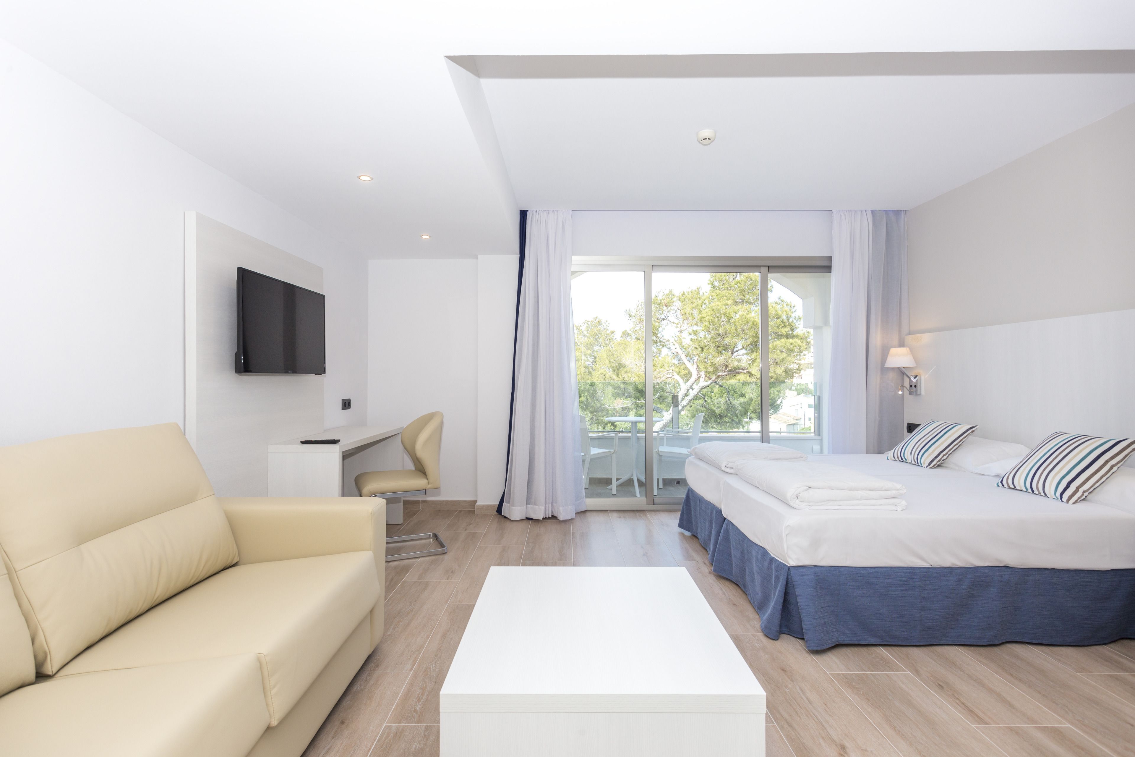 minibar, desk, blackout curtains, iron/ironing board