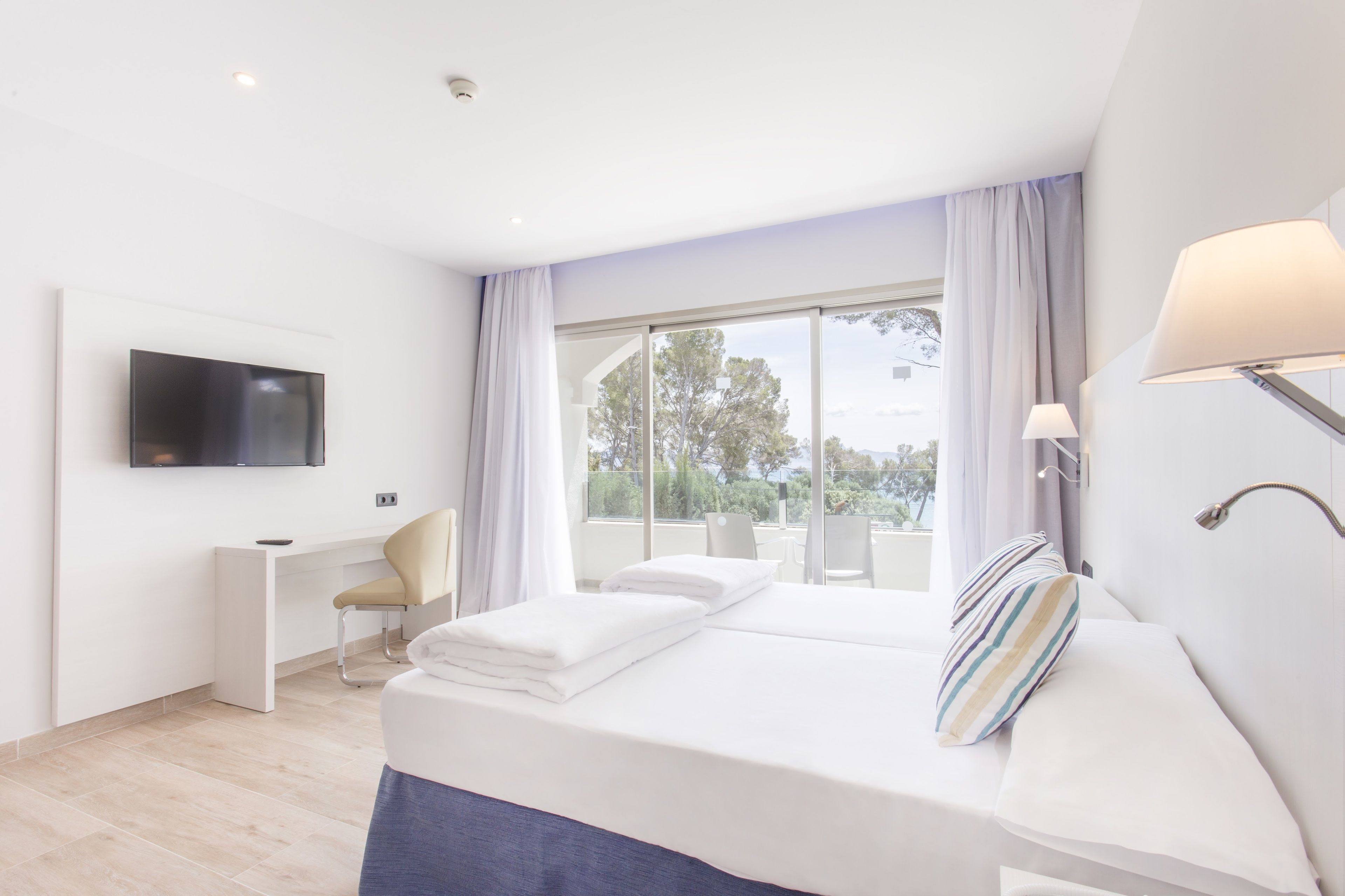 minibar, desk, blackout curtains, iron/ironing board