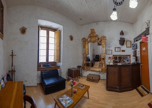 Family Apartment, 1 Bedroom, Garden View | Living area | 32-inch TV with cable channels