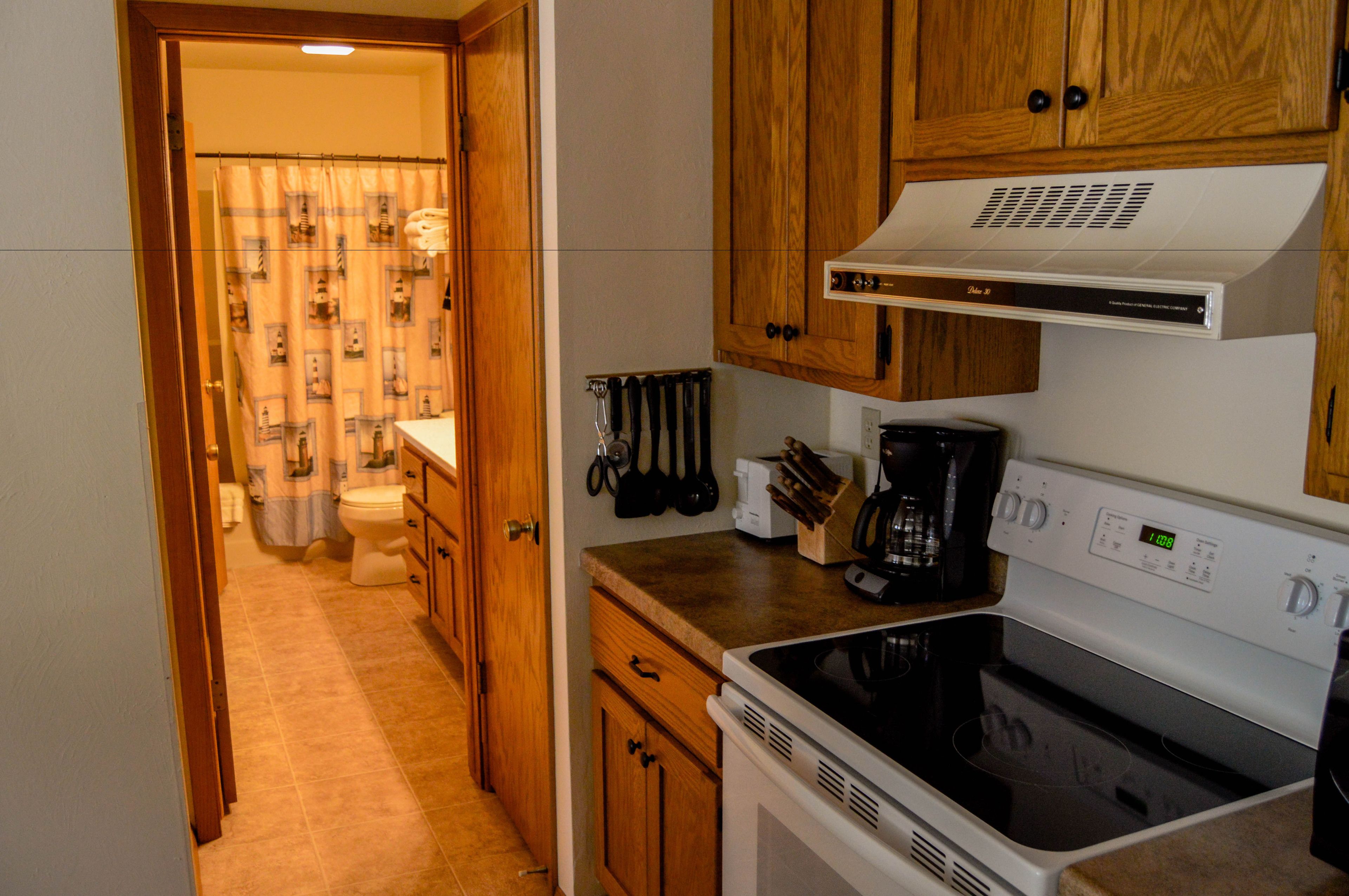 condo, 1 king bed with sofa bed (admirals) | private kitchen | fridge, microwave, stovetop, dishwasher