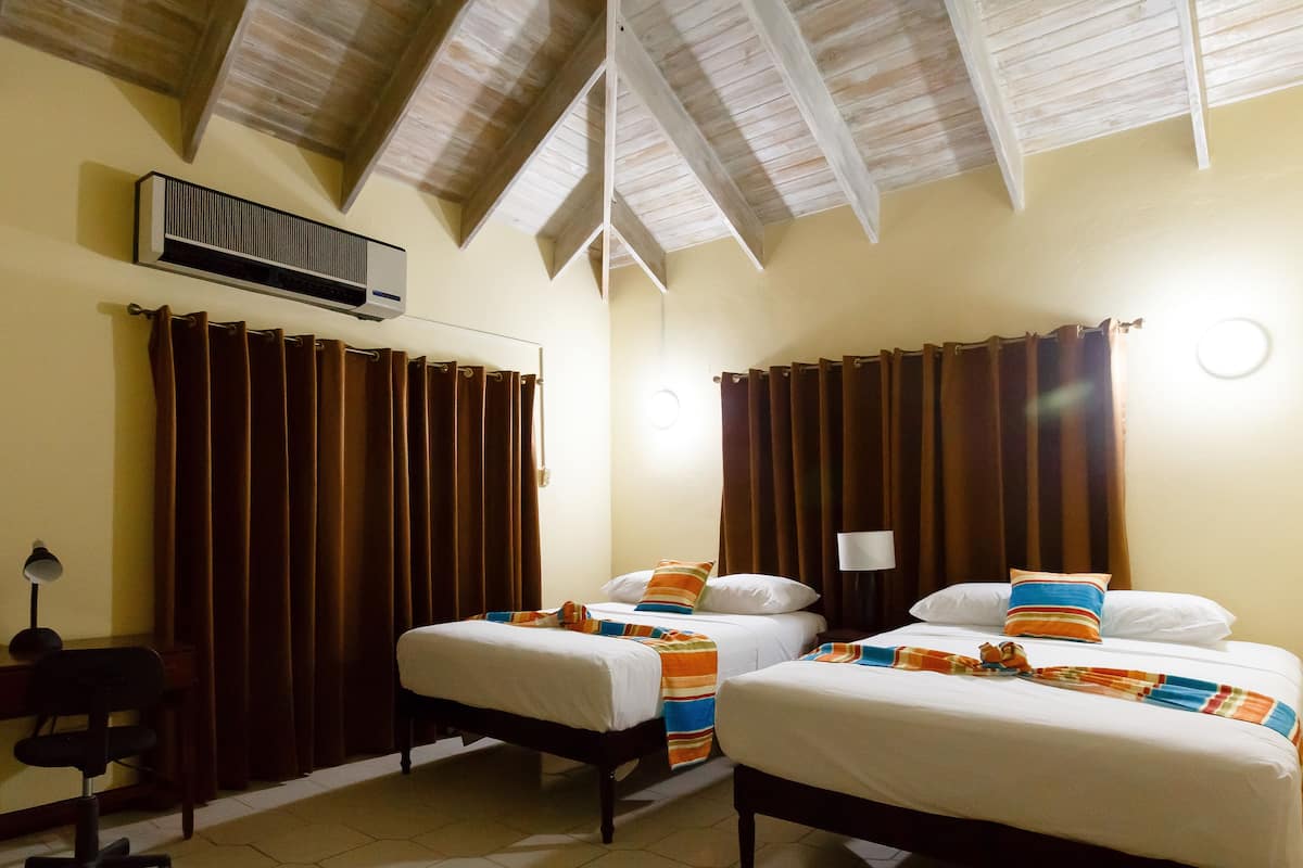 deluxe room, 2 double beds | in-room safe, iron/ironing board, free wifi, bed sheets