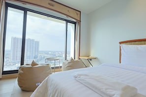Quarto duplo luxo | Área de estar | TV