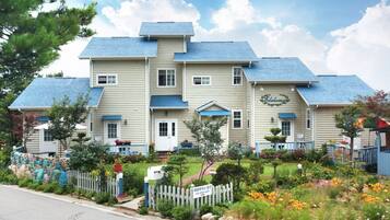 Stunning two-story building with a central entrance and charming porch area.