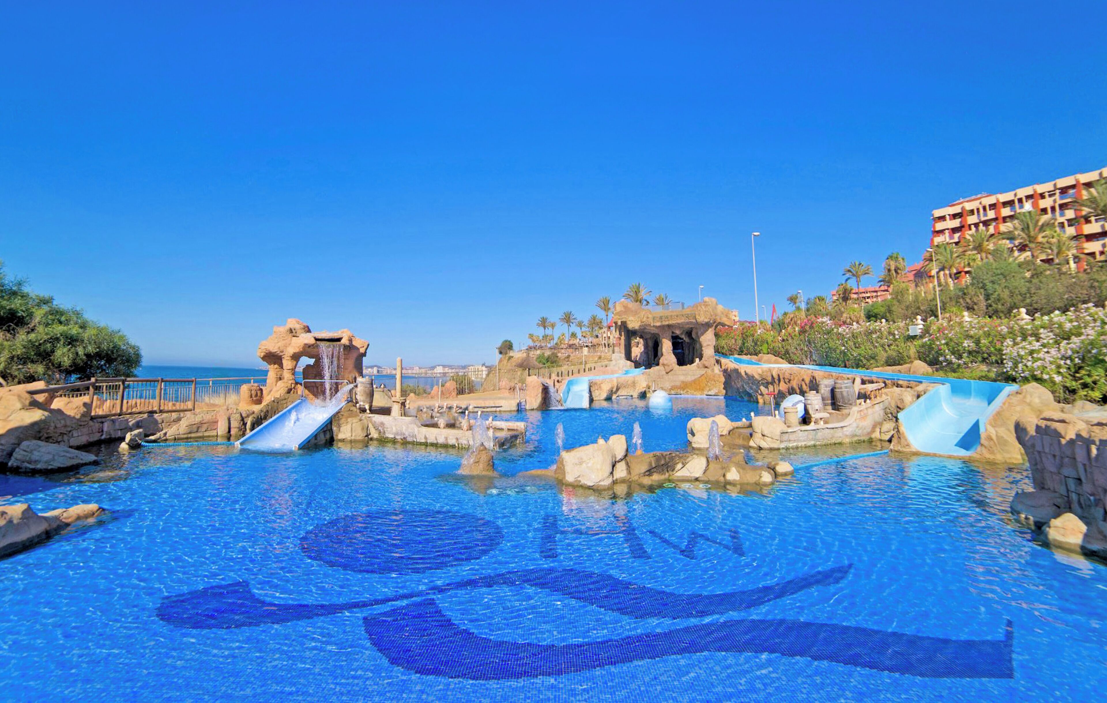Outdoor pool, pool umbrellas, sun loungers