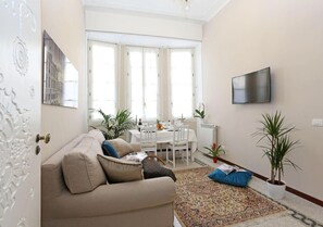 Deluxe Condo, 1 Bedroom, City View, Executive Level | Living area | Flat-screen TV