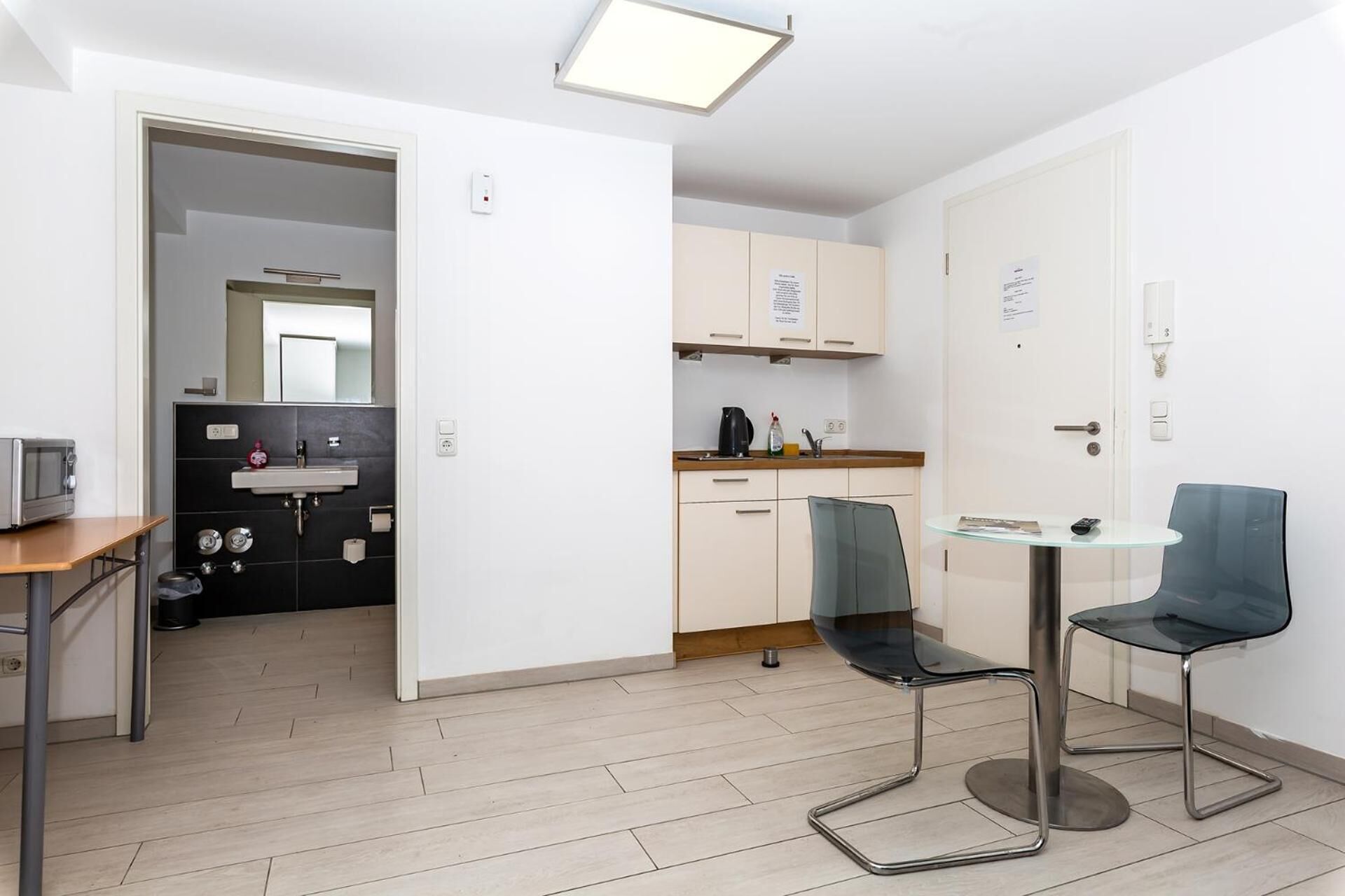 full-sized fridge, microwave, stovetop, electric kettle