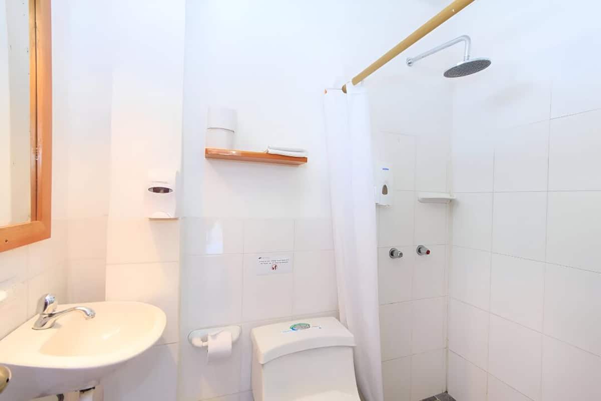 standard quadruple room | bathroom | shower, hair dryer, towels, soap