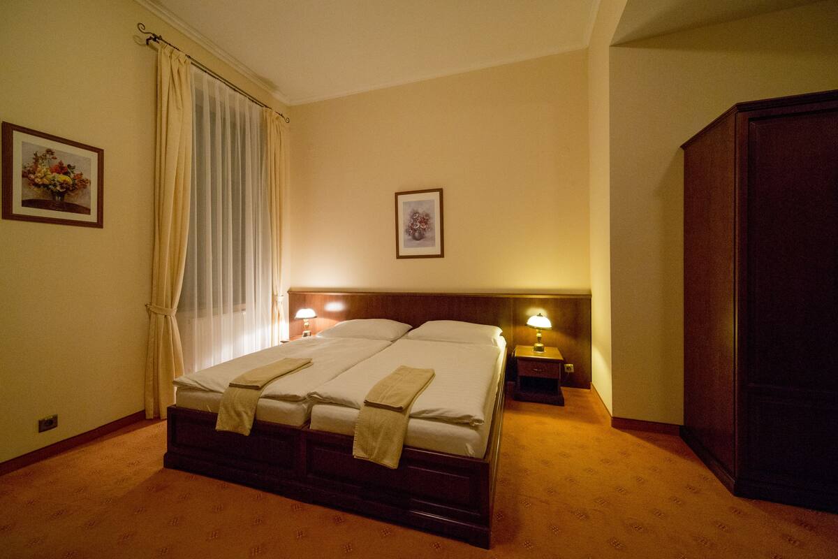 Minibar, desk, blackout curtains, iron/ironing board