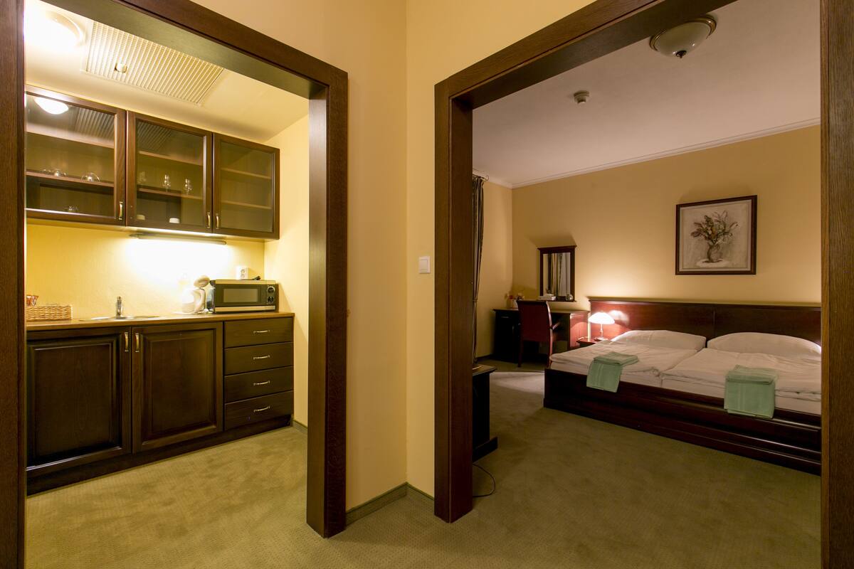 Minibar, desk, blackout curtains, iron/ironing board