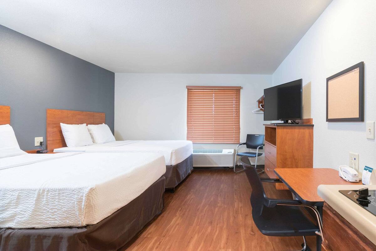 Desk, laptop workspace, free WiFi, bed sheets