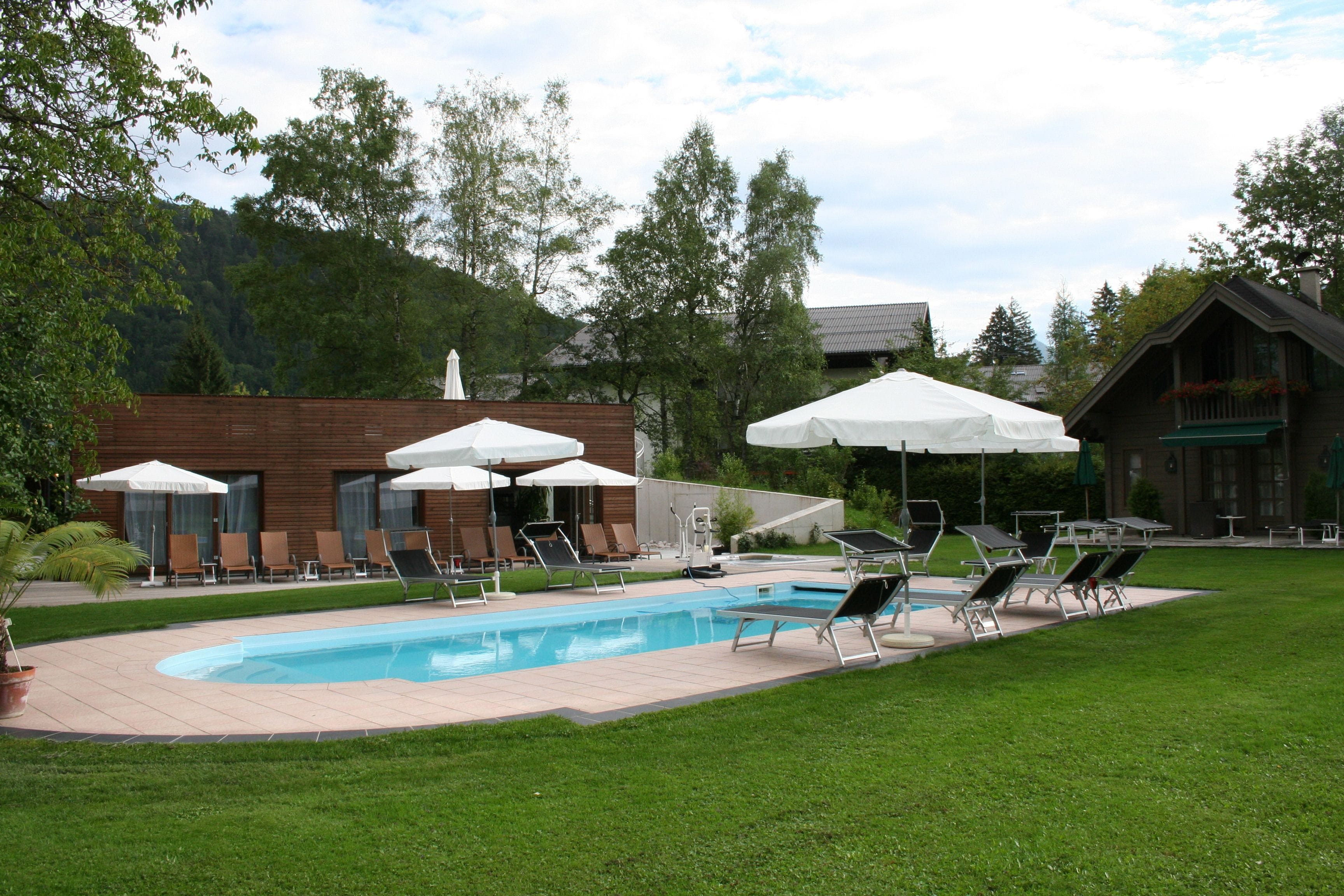 outdoor pool, pool umbrellas, pool loungers